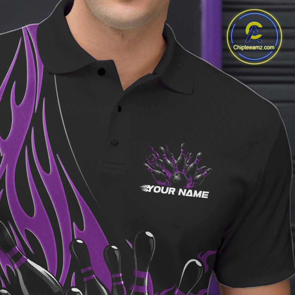 Close-up view of the left chest area of a black bowling polo shirt showing a purple flaming black bowling ball and pins design detail.