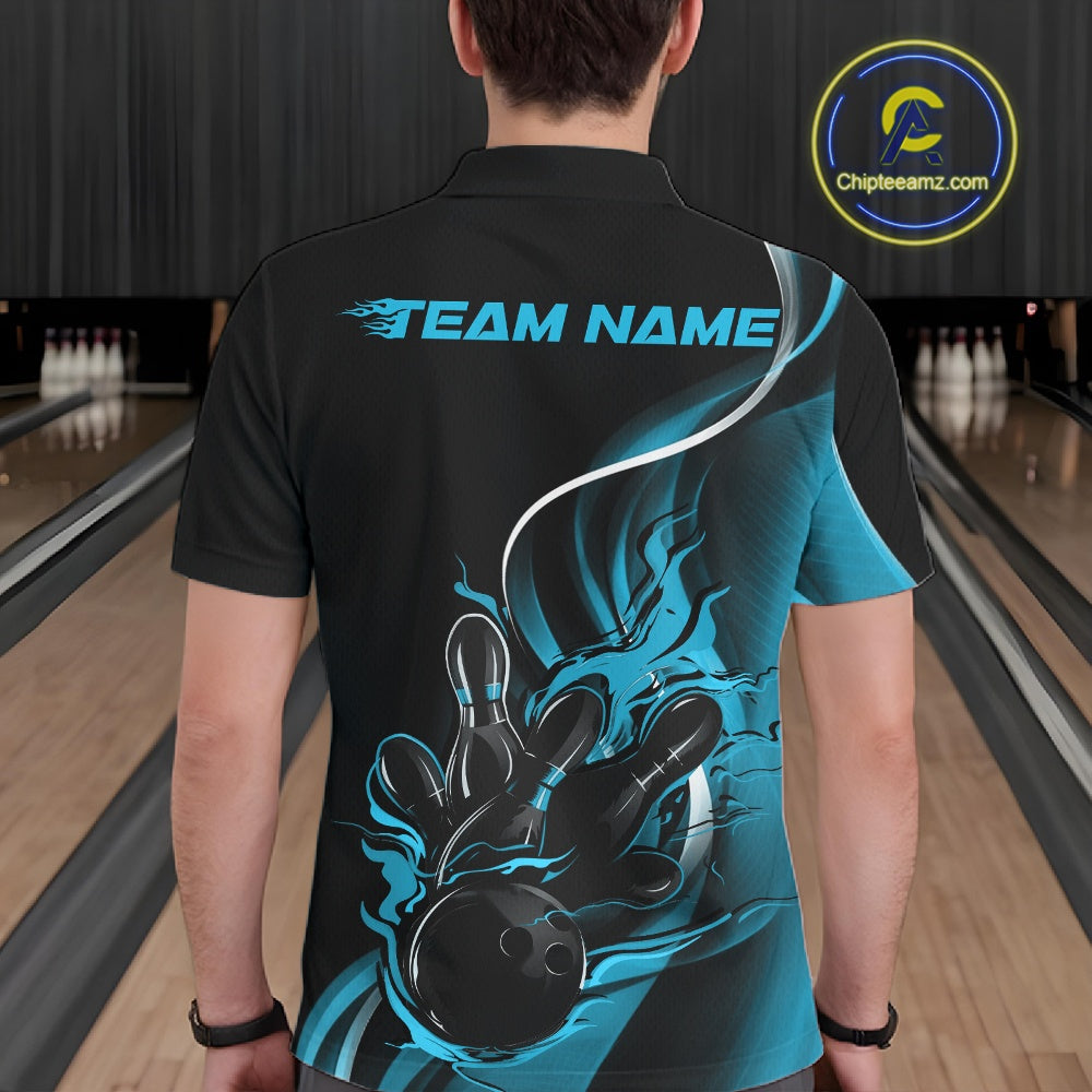Male model seen from the back in a bowling lane wearing a black and blue polo shirt featuring a flame bowling ball striking pins in a dynamic motion scene.