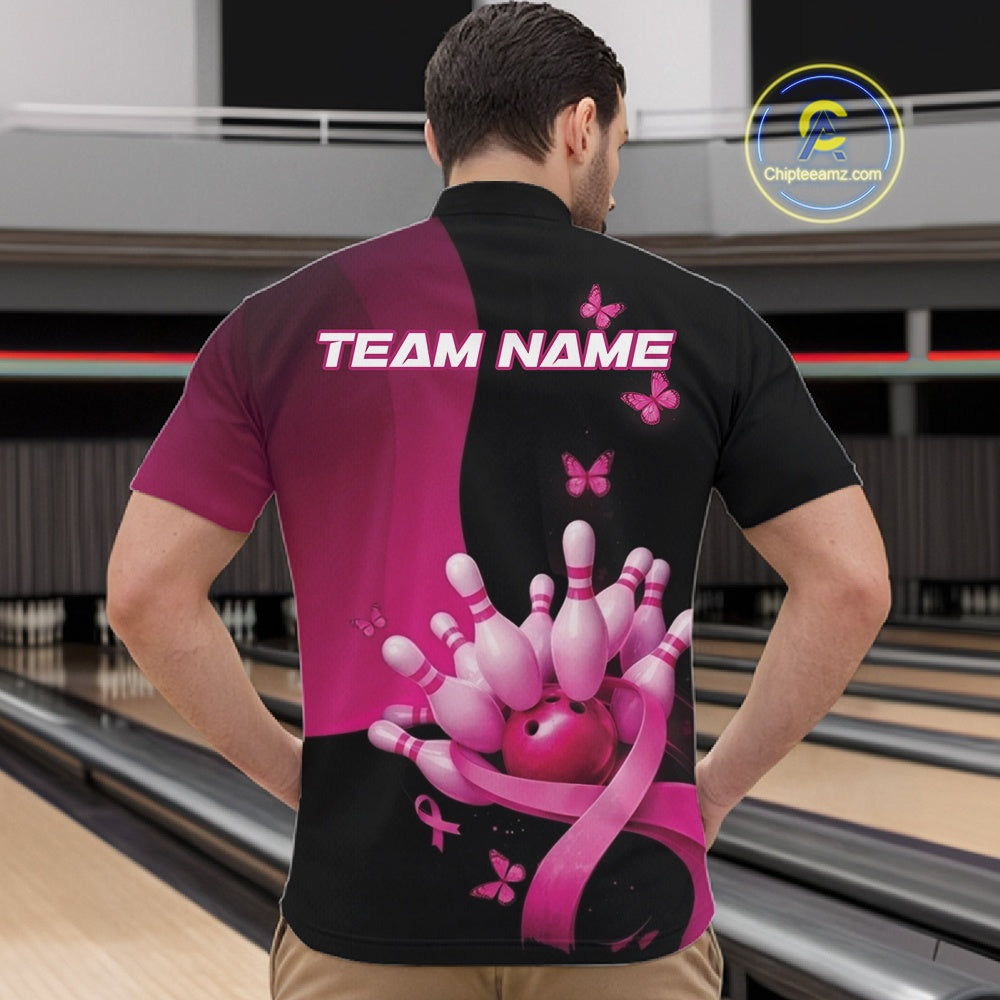 Male model in a bowling lane wearing a black and pink quarter zip shirt, featuring pink ribbon accents, butterflies, and bowling action graphics.