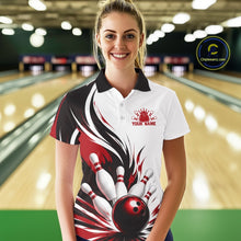 Load image into Gallery viewer, Front view of a female model wearing a white, black, and red bowling polo shirt with a flaming bowling ball hitting the pins illustration inside a bowling lane.