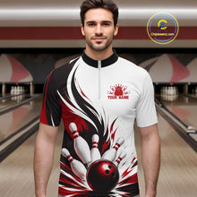 Load image into Gallery viewer, Front view of a male model wearing a white, black, and red bowling quarter zip shirt showcasing a flaming bowling ball hitting the pins artwork in a bowling lane.