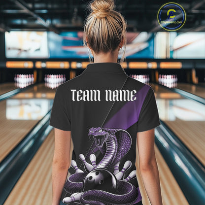 Back view of a black womens bowling polo displaying a purple cobra wrapped around a bowling ball with scattered pins.