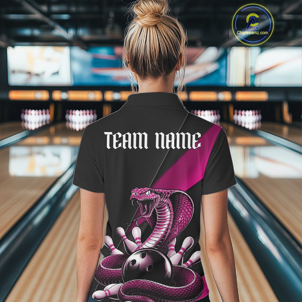 Back view of a black womens bowling polo displaying a pink cobra wrapped around a bowling ball with scattered pins.