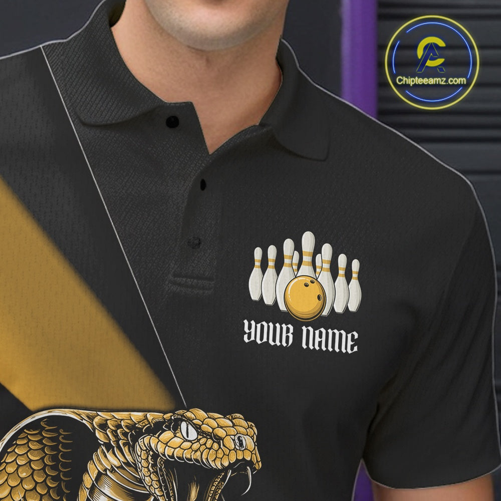 Left chest close-up of a black bowling polo featuring a yellow cobra, bowling ball, and scattered pin artwork.