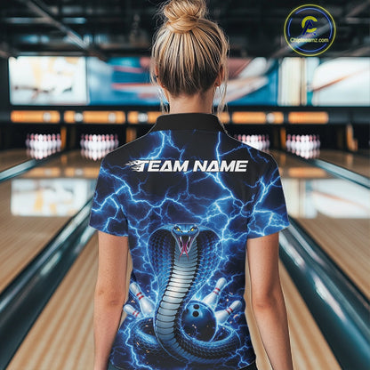 Back view of a womens bowling polo displaying a blue cobra around a bowling ball with lightning accents.