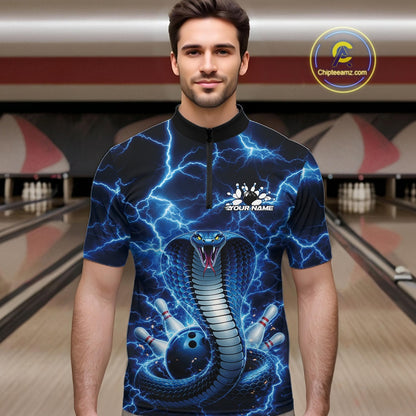 Male model at the bowling lane wearing a quarter-zip with blue cobra and bowling ball graphics against lightning.