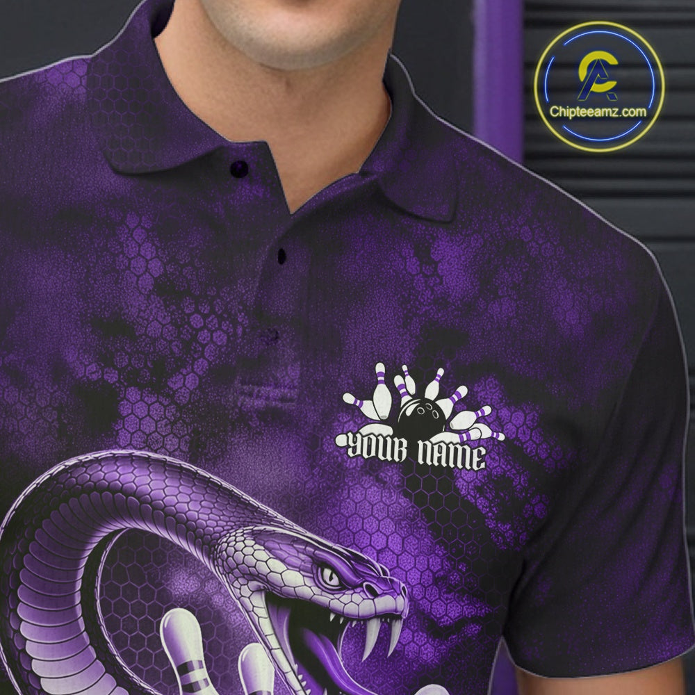 Close-up left chest detail of a bowling polo featuring a purple cobra coiled around a bowling ball with scattered pins.