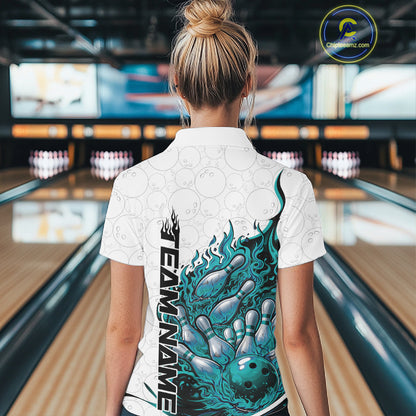 Back view female model in bowling lane wearing polo shirt with flaming bowling ball crashing into pins fiery white and turquoise blue design