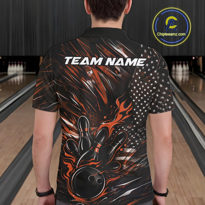 Back view of a male model in a bowling venue wearing a black and orange polo shirt featuring a patriotic bowling strike motif.
