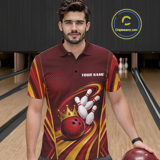 A man wearing a custom bowling-themed short-sleeve polo shirt with a red, yellow, and black graphic design featuring bowling pins, a bowling ball, and a crown, set against a bowling alley background.