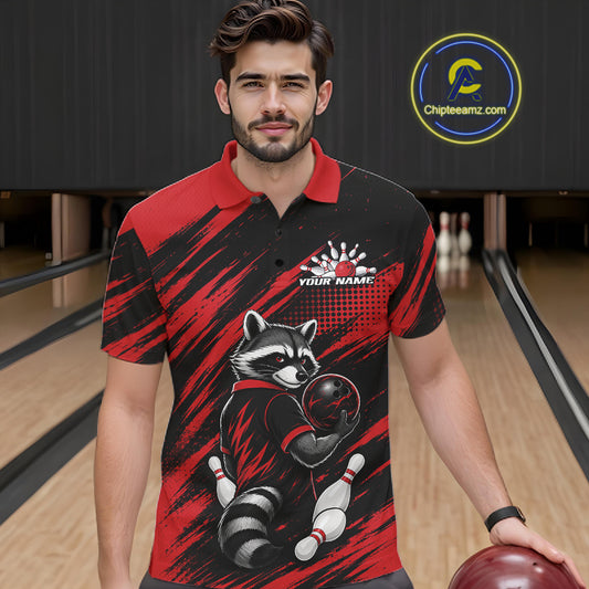 A man in a bowling alley wearing a custom short-sleeve bowling polo shirt with a raccoon graphic and red and black brushstroke pattern. 