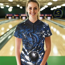 Load image into Gallery viewer, Woman wearing a blue dragon-themed bowling shirt in a bowling alley.
