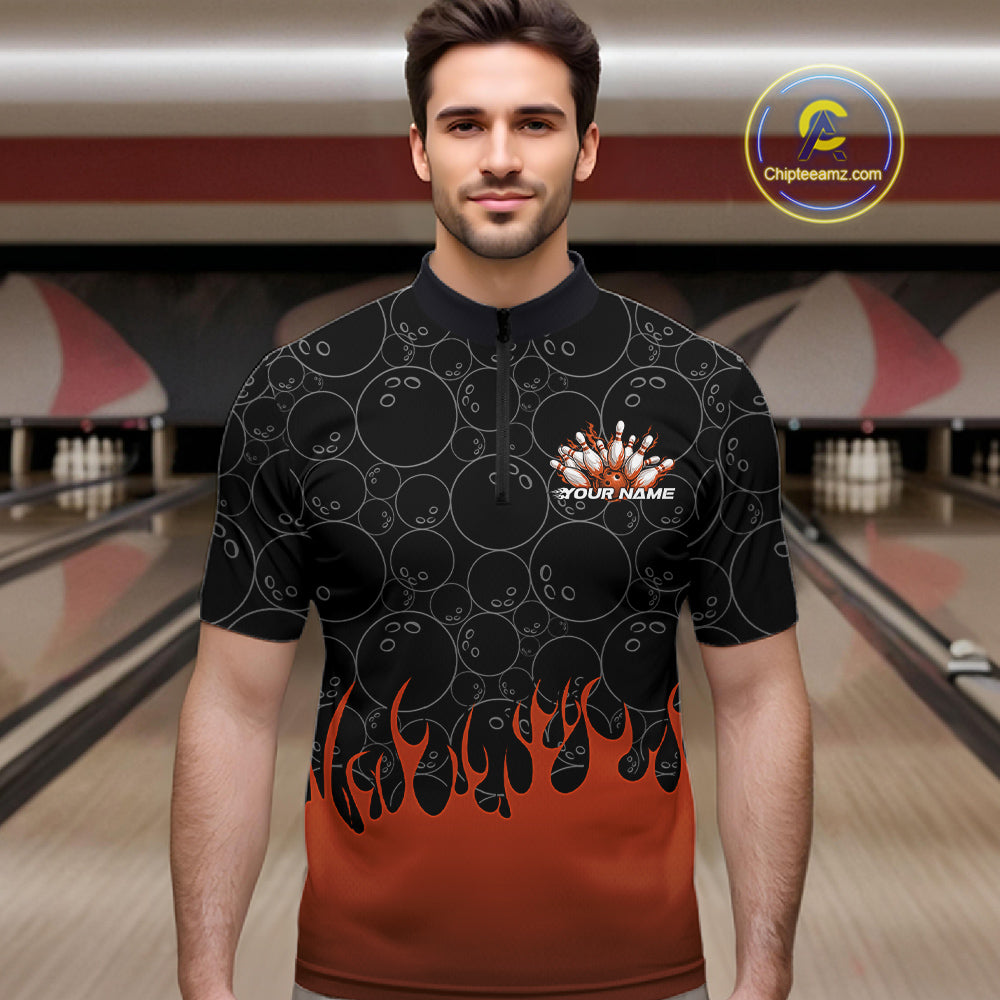 Male model in a bowling lane wearing black quarter zip shirt, front view featuring orange flames rising with bowling ball pattern and energetic sports design