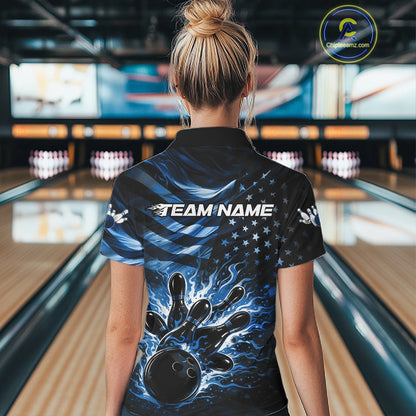 Back view of a female model in a black bowling quarter-zip shirt displaying blue flame bowling graphics and distressed flag motifs.