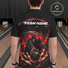 Load image into Gallery viewer, Back view of a male model wearing a black and red bowling polo shirt featuring a grim reaper reaching through swirling flames to command a blazing bowling ball crashing into scattered pins in a bowling lane.