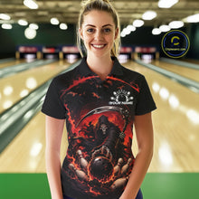 Load image into Gallery viewer, Front view of a female model wearing a black and red bowling polo shirt featuring a grim reaper commanding a blazing bowling ball crashing into scattered pins through swirling flames in a bowling lane.