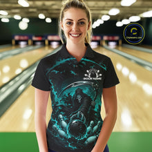 Load image into Gallery viewer, Front view of a female model wearing a black and cyan blue bowling polo shirt featuring a grim reaper commanding a blazing bowling ball crashing into scattered pins through swirling flames in a bowling lane.