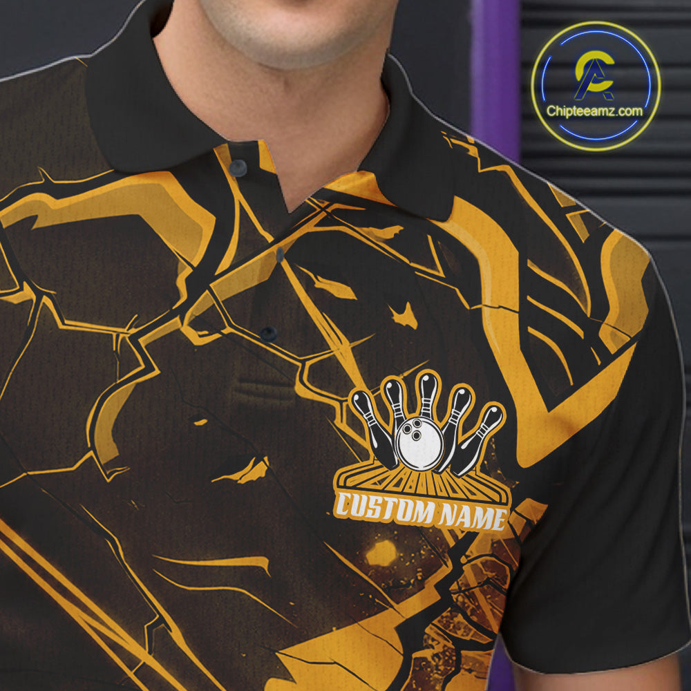 Left chest close-up of a bowling polo with black and yellow cracked geometric linework.