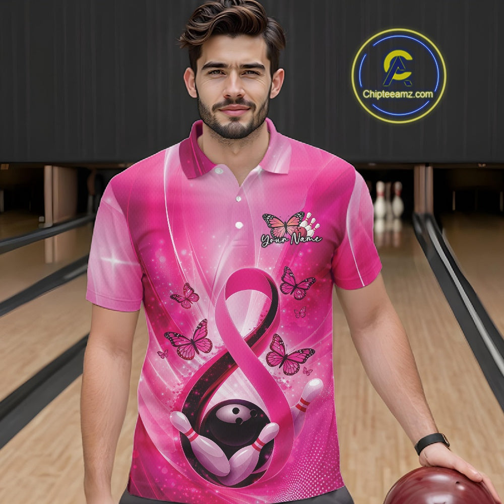 Male model wearing a bowling polo in a bowling lane displaying pink ribbon awareness artwork with butterflies and bowling elements.