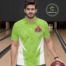 Load image into Gallery viewer, Front view of a male model in a bowling alley wearing a light green custom bowling polo shirt with a funny aggressive crawfish holding a bowling ball in a sporty design style.