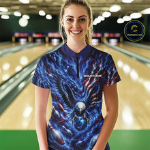 Load image into Gallery viewer, Front view female model at the bowling lane wearing a quarter zip shirt with eagle graphics, bowling ball, flowing flag accents, and pins.