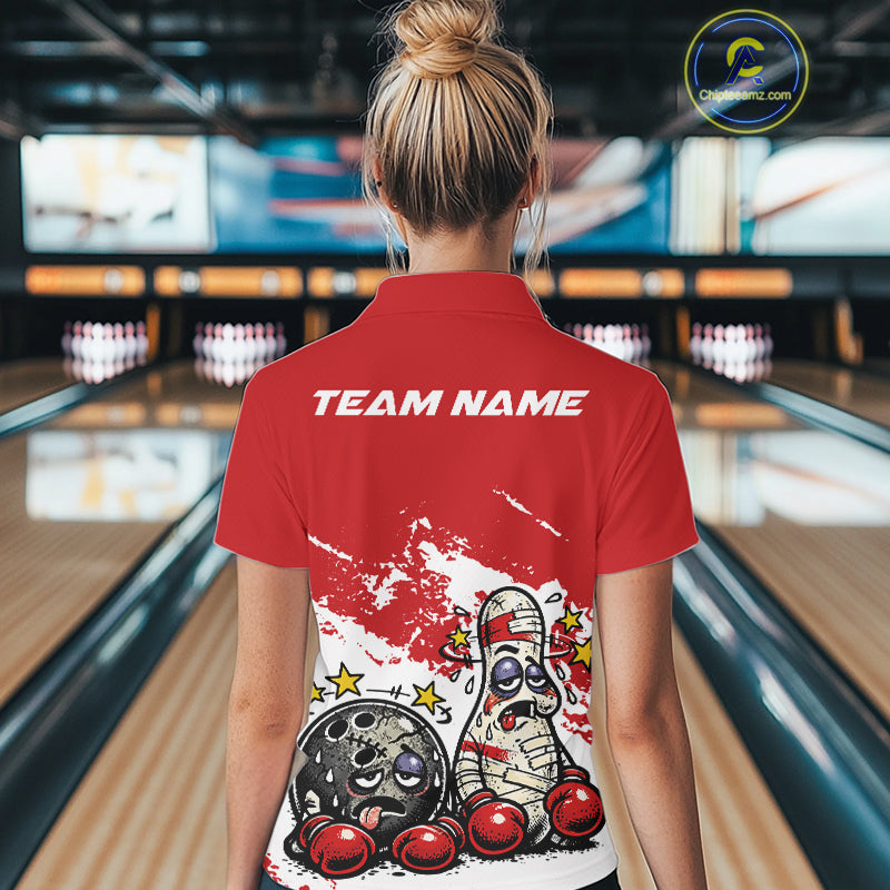 Back view of a female bowler wearing a red and white polo shirt, boxing-style bowling ball and pin design showing playful beaten-up fighter concept.