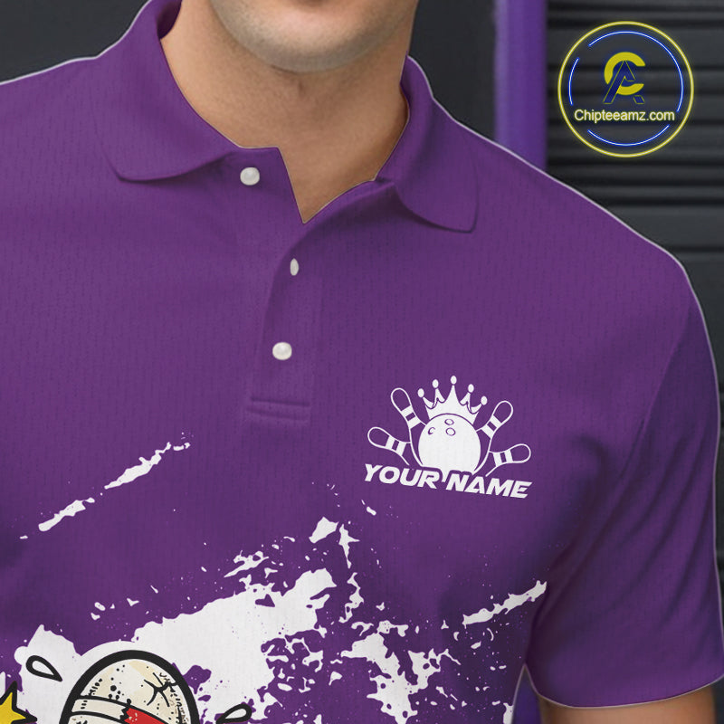 Close-up view of left chest area of a purple and white polo shirt, showing small detailed boxing bowling ball and pin graphic.