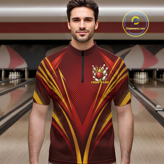 A man wearing a custom bowling shirt with a red, yellow, and black geometric pattern, standing in a bowling alley. The shirt features a small bowling pin and ball graphic with the text 'YOUR NAME' on the left chest.