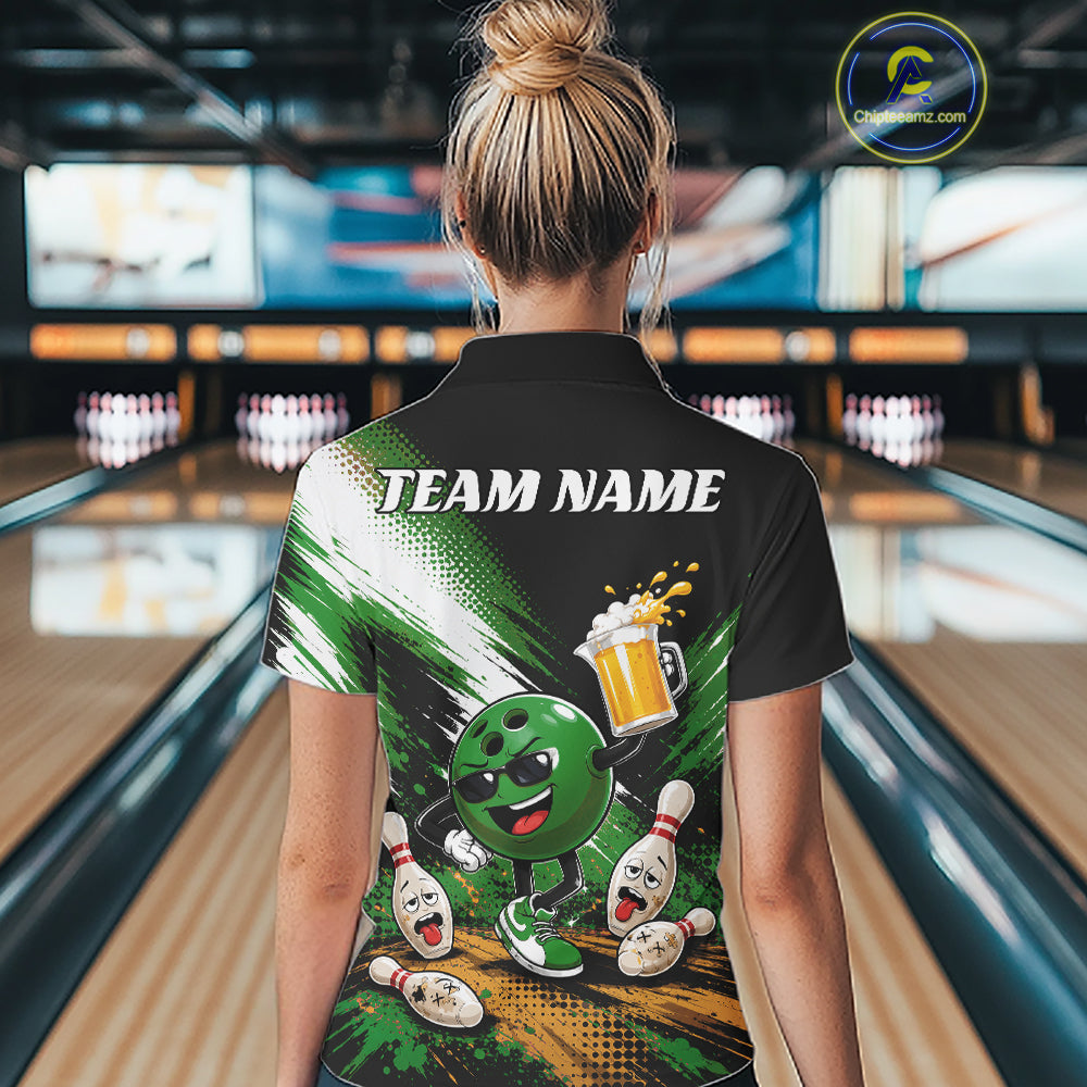 A woman viewed from behind wearing a black short-sleeve bowling-themed quarter zip shirt with a large green and white graphic print featuring a bowling ball character, pins, and the text 'TEAM NAME'. 