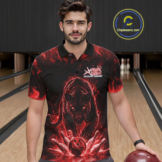 Front view of a male model in a bowling lane wearing a black polo shirt with glowing red electric panther and bold bowling strike artwork.