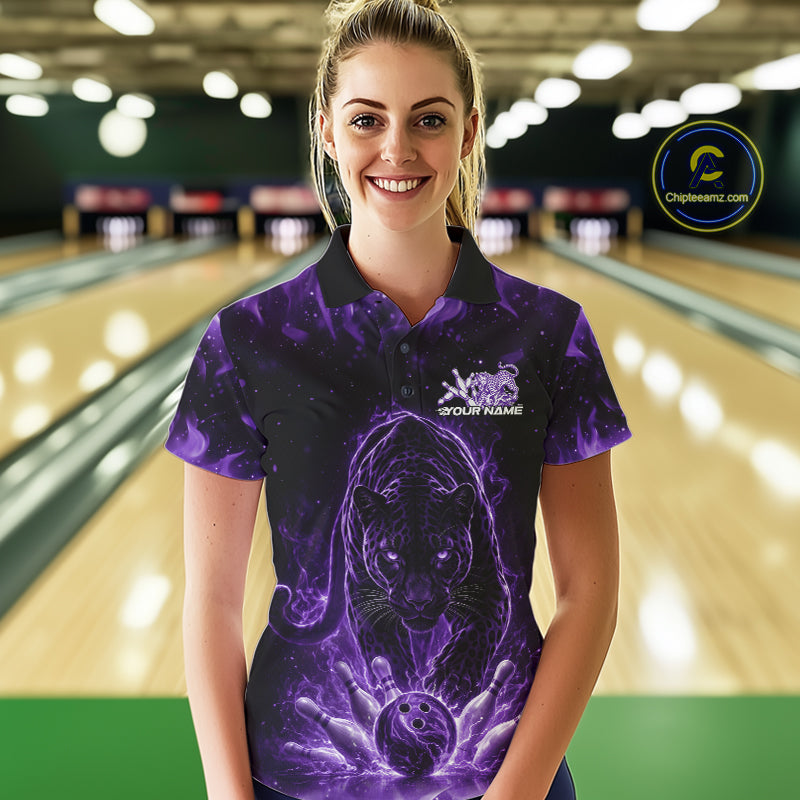 Front view of a female model in a bowling lane wearing a black polo shirt with glowing purple electric panther and bowling action illustration.