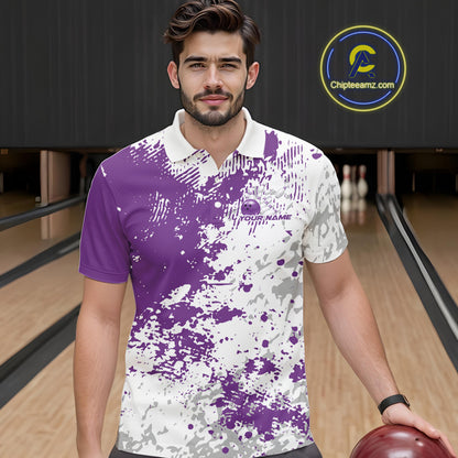 Front view of a male model in a bowling lane wearing a purple and white splatter polo shirt with clean sporty bowling graphics.