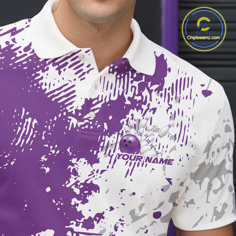 Close-up view of the left chest of a purple and white splatter bowling polo shirt showing abstract sporty bowling design detail.