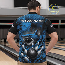 Load image into Gallery viewer, Person wearing a blue and black bowling shirt with a shark design in a bowling alley.
