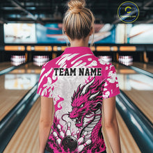 Load image into Gallery viewer, Person wearing a pink bowling shirt with dragon design and 'TEAM NAME' text in a bowling alley.