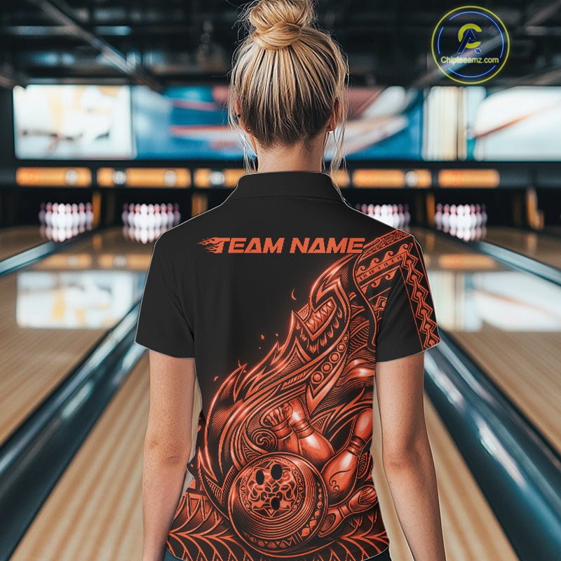 Back view of a female model in a black and orange bowling quarter-zip shirt showcasing flowing tribal bowling artwork.