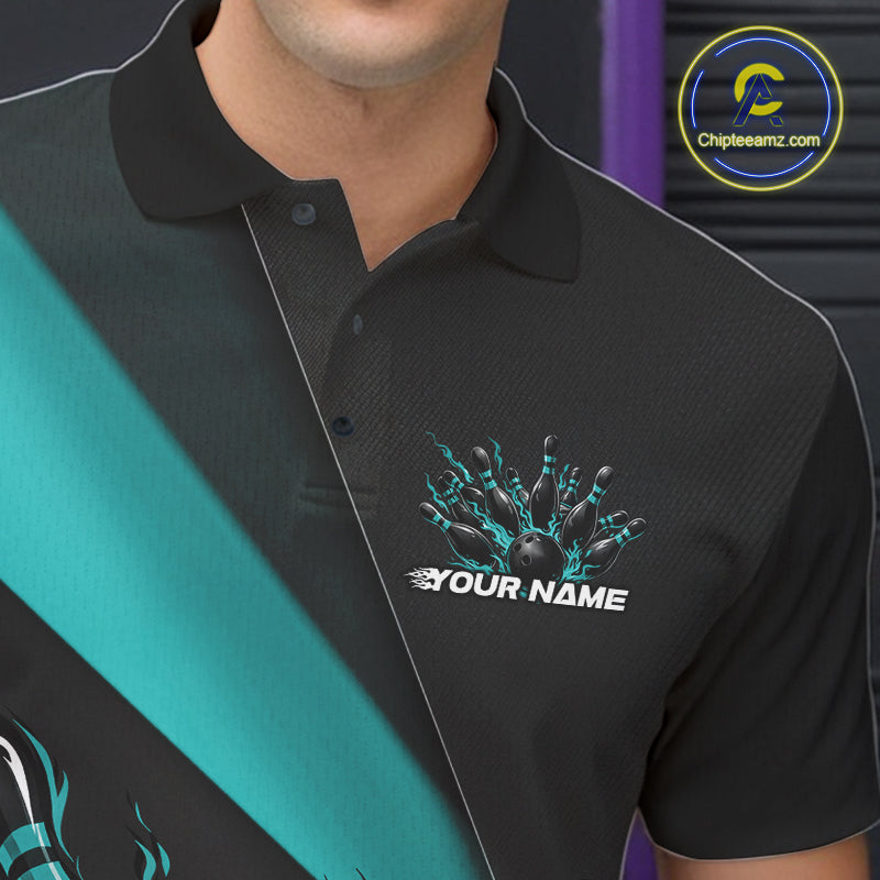 Close-up view of the left chest area of a black and turquoise blue bowling polo shirt showing a flame bowling ball and pins design detail.