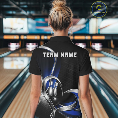 Back view of a female model in a bowling venue wearing a black and blue polo shirt, showcasing honeycomb pattern and heart-shaped bowling ball hitting pins design.