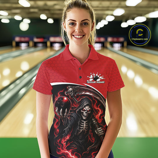 A woman wearing a red and black bowling-themed graphic polo shirt with a grim reaper design, standing in front of a blurred bowling alley background. 