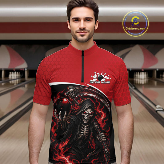 A man wearing a red short-sleeve quarter-zip bowling shirt with a large black and red grim reaper graphic on the front, standing in a bowling alley. The shirt features a black zipper, a white custom logo area on the chest, and a red bowling ball graphic.