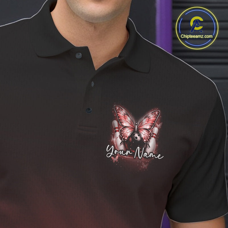 Close-up of the left chest on a red bowling polo shirt featuring glowing butterfly artwork with bowling-inspired cosmic details.