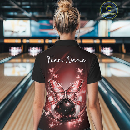 Back view of a female model in a bowling alley wearing a red polo shirt showcasing luminous butterflies and bowling-themed graphics.