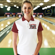Load image into Gallery viewer, A woman stands in a bowling alley wearing a bowling shirt with polo collar, red skull-themed bowling graphic with black wings, pins, bowling ball