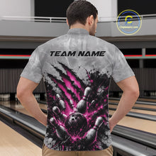 Load image into Gallery viewer, Front view of a male model wearing a gray bowling quarter zip shirt featuring a dramatic pink bowling ball and pins graphic with bold claw-mark artwork in a bowling lane.