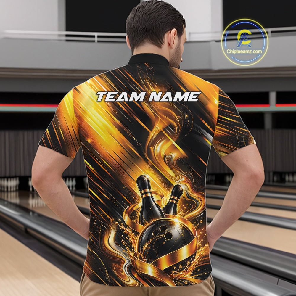 Male model wearing a bowling quarter zip shirt featuring a black and gold bowling ball striking pins with flowing metallic ribbon accents, shown from the front in a bowling lane.
