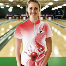 Load image into Gallery viewer, Female model in a white and red bowling quarter zip with flowing wave artwork and glossy bowling strike graphics, front view at the bowling lane