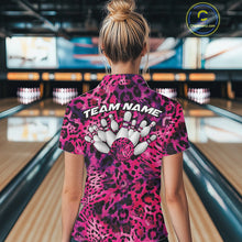 Load image into Gallery viewer, Back view of a woman standing at a bowling alley, wearing a gold, brown, and black leopard-print bowling polo with “Team Name” and bowling pins on the back.
