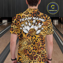 Load image into Gallery viewer, Back view of a man wearing a yellow, brown, and black leopard-print bowling shirt with “Team Name” above bowling pins and a patterned ball.