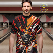 Load image into Gallery viewer, Front view of a male model wearing a black, red, and orange bowling quarter zip shirt featuring a crowned cartoon bowling ball holding a royal scepter with animated bowling pins and vibrant burst graphics in a bowling lane.