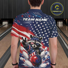Load image into Gallery viewer, Back view of a male model wearing a bowling polo shirt showcasing a patriotic raccoon flashing a peace sign, a red, white, and blue bowling ball knocking down pins, and an American flag in a bowling lane.